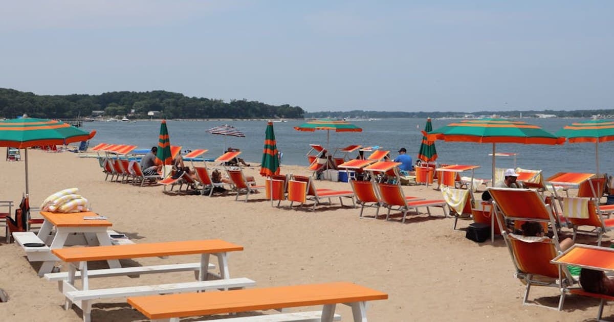 Colorful beach chairs and umbrellas on a sunny day at Shelter Island, NY.