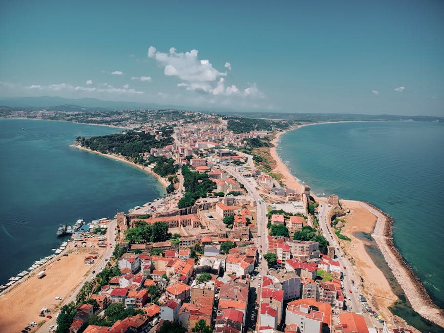 Stunning aerial shot of Sinop's coastline, showcasing vibrant cityscape and serene beaches.