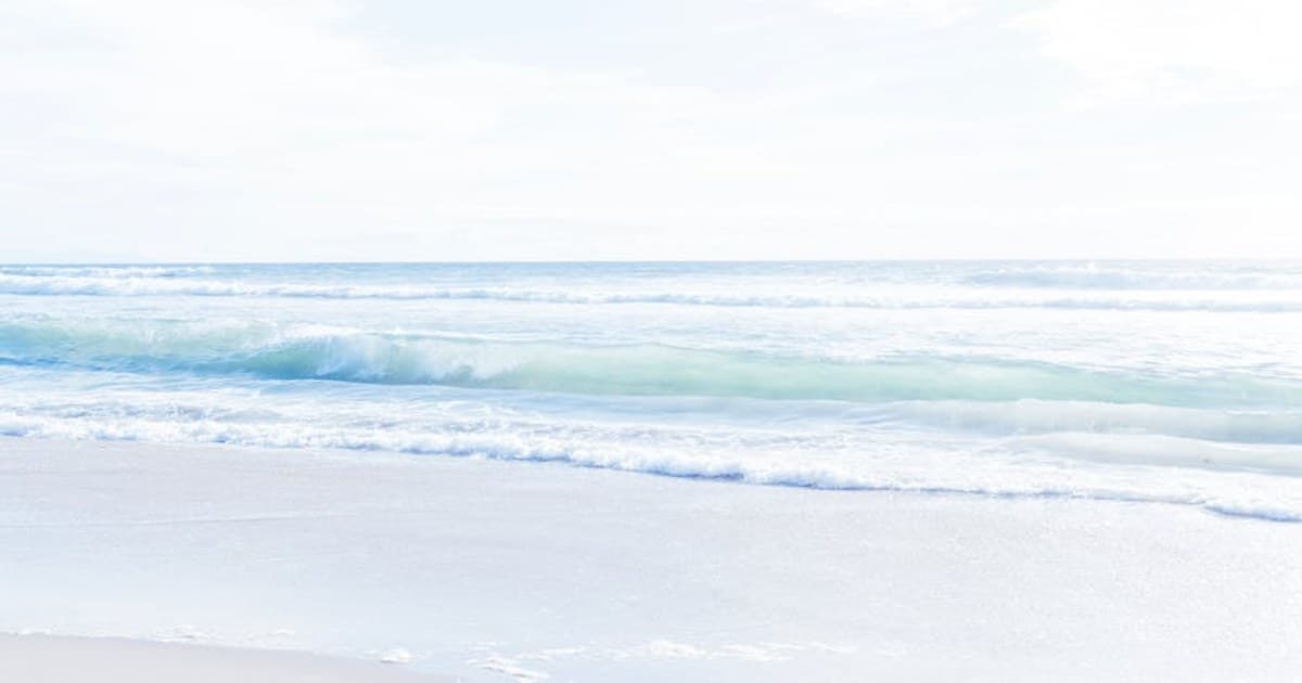Gentle waves on a serene beach in Los Angeles under bright daylight.