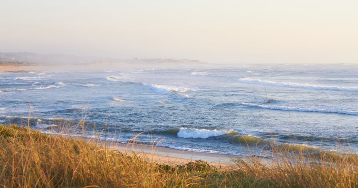 Tranquil seascape with waves crashing against the shore at Vila do Conde, Portugal.