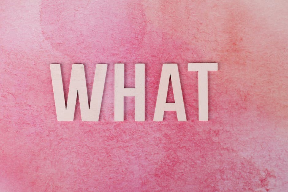 Creative pink background with the word 'WHAT' in bold white letters.